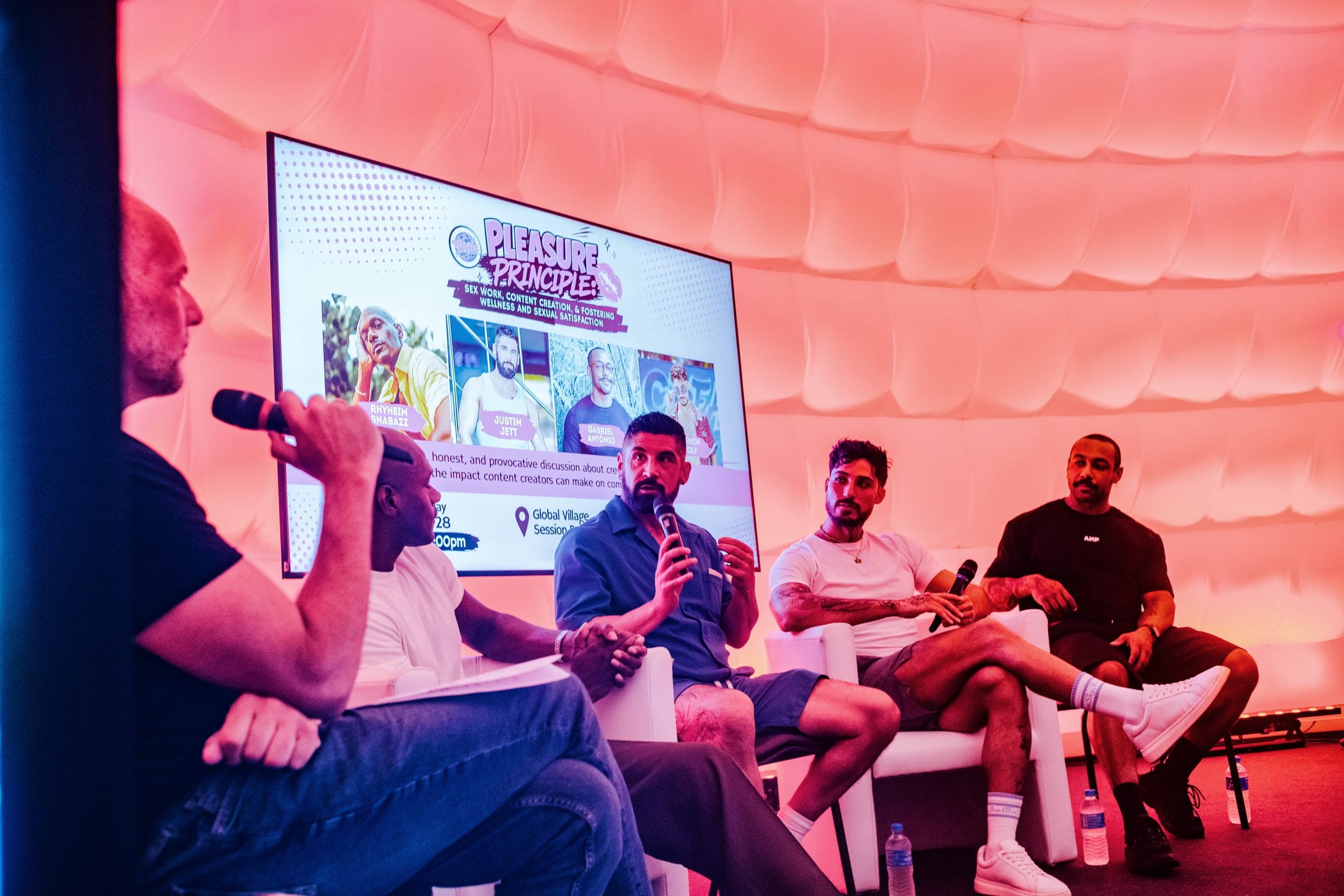 A panel discussion on stage at a community event